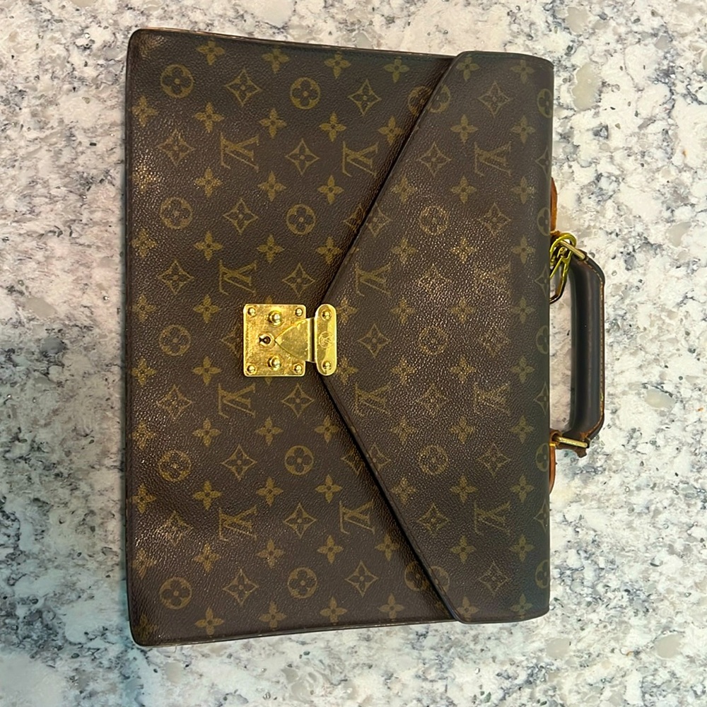 Well loved Louis Vuitton Briefcase. Sold as is. Price negotiable
